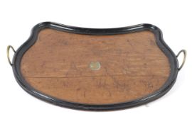 A twin handled tray of unusual form.