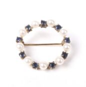 A modern 9ct gold, sapphire and cultured-pearl circlet brooch.