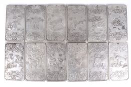 A set of twelve Chinese white metal zodiac ingots. All depicting a different animal, all signed.