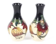 A pair of Moorcroft Pottery Anna Lily pattern oviform vases. Impressed marks, painter's KM and c.