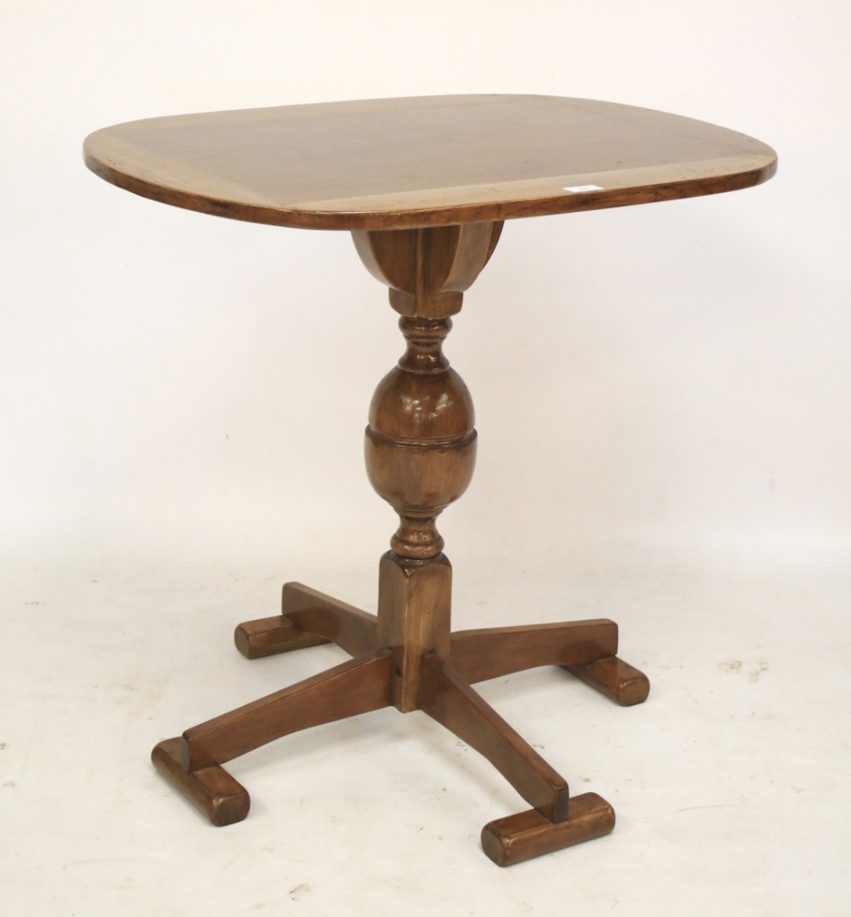 An ecclesiastical oak oval topped table.