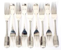 A set of nine silver desert table forks.