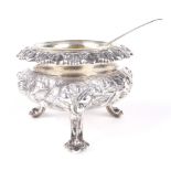 A fine silver gilt embossed open glass lined salt.