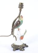 A Continental porcelain Meissen-style parrot and gilt-metal mounted table lamp.