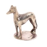 An unusual white metal figure of a greyhound mounted on a silver base.