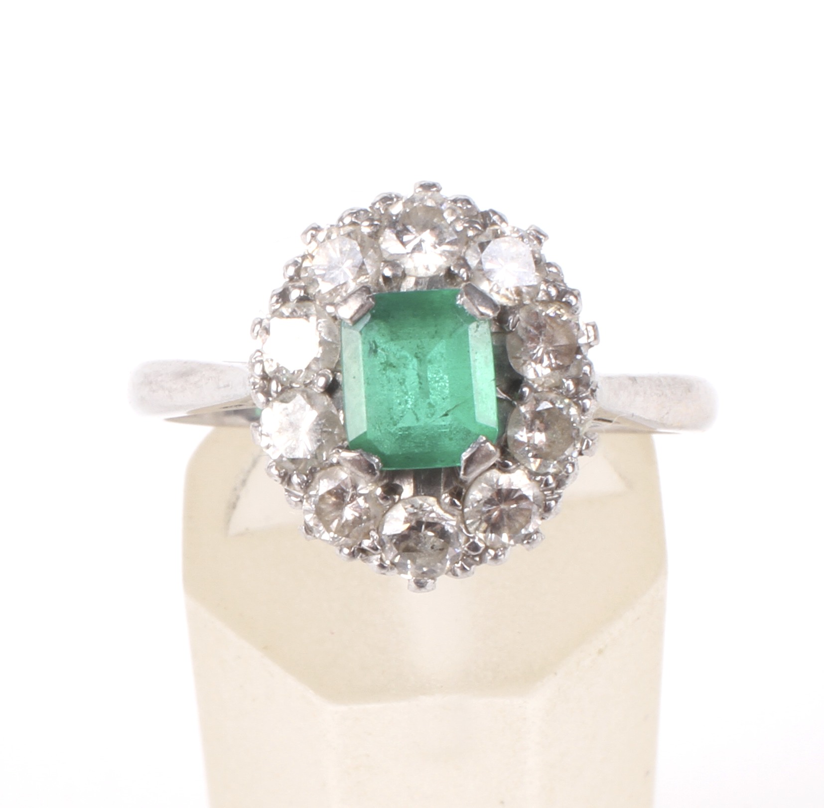 A mid 20th century white gold, emerald and diamond oval cluster ring. - Image 2 of 4