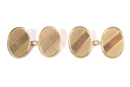 A pair of early 20th century 9ct rose gold oval twin-panel cufflinks.
