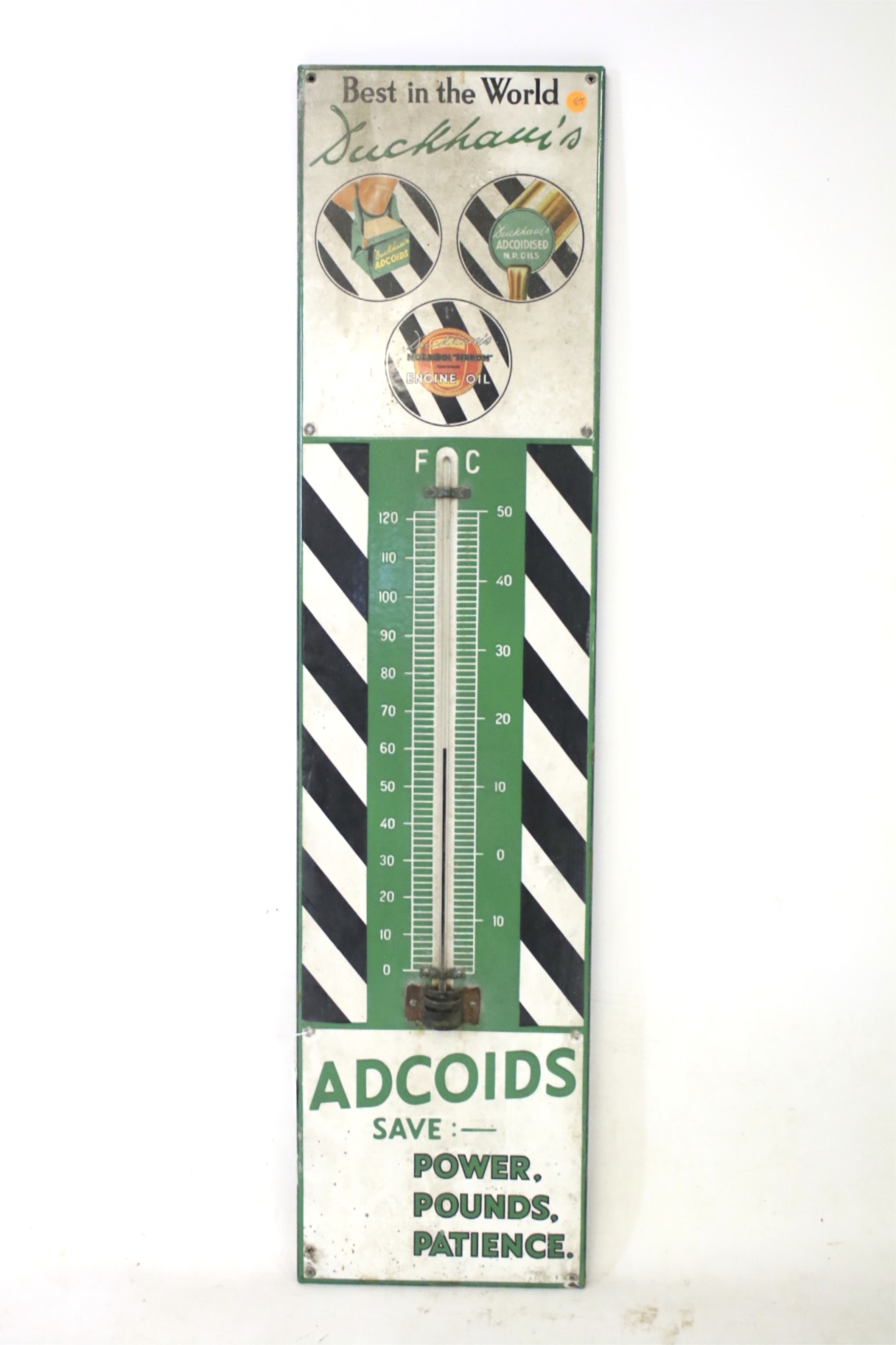 An original enamel Ducham's Adcoids engine oil and thermometer sign.