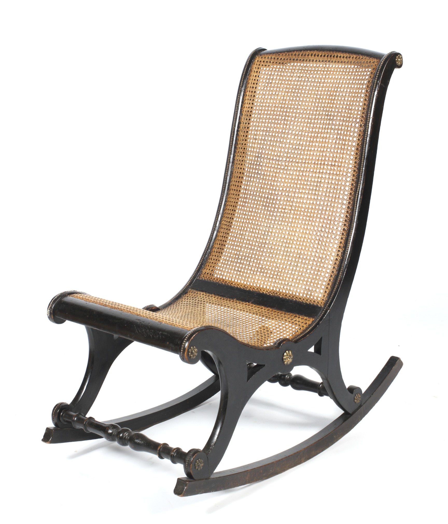 An early 20th century ebonised cane rocking chair.
