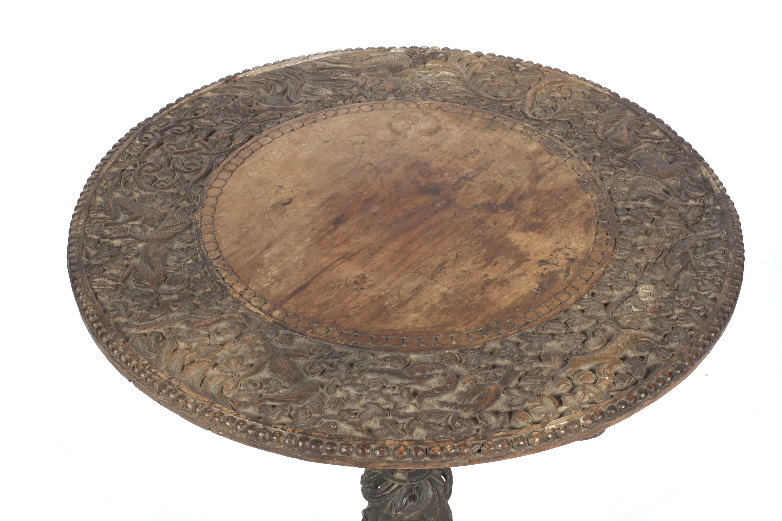 An Anglo-Indian circular tilt top table with carved decoration. - Image 2 of 2