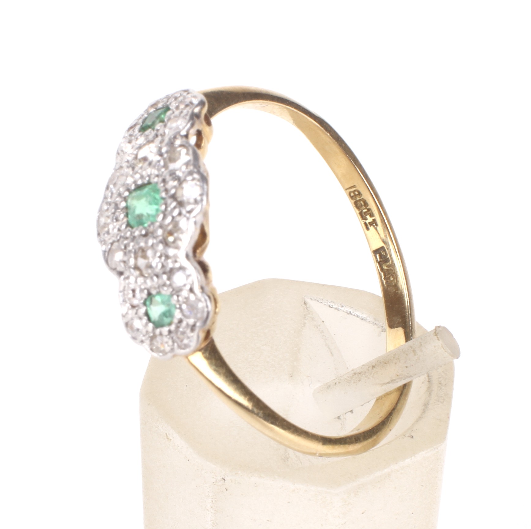 An early 20th century gold, emerald and diamond triple-cluster ring, circa 1930. - Image 4 of 4