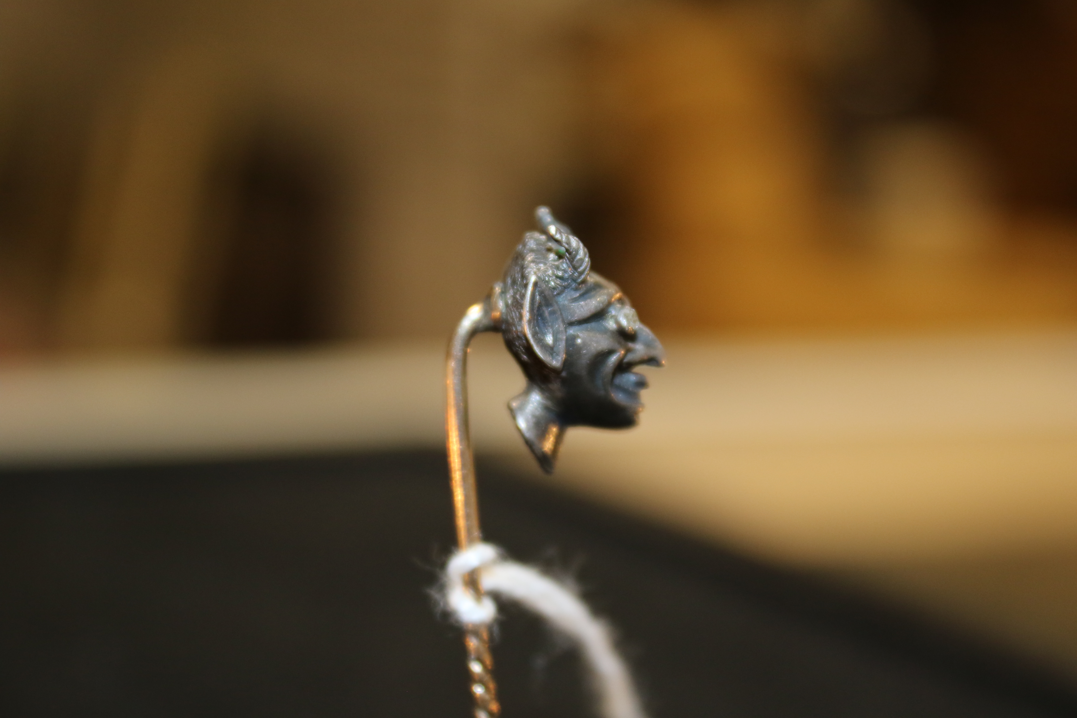 An early 20th century emerald and diamond 'devil's head' stick pin. - Image 6 of 6