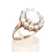 A vintage 9ct gold and white-opal oval cluster ring.