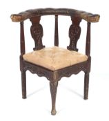 A 19th century mahogany leather button upholstered corner chair.