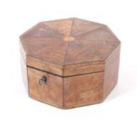 A maple octaganal shaped lidded box, with eight sectioned lidded top with inlaid border 17.