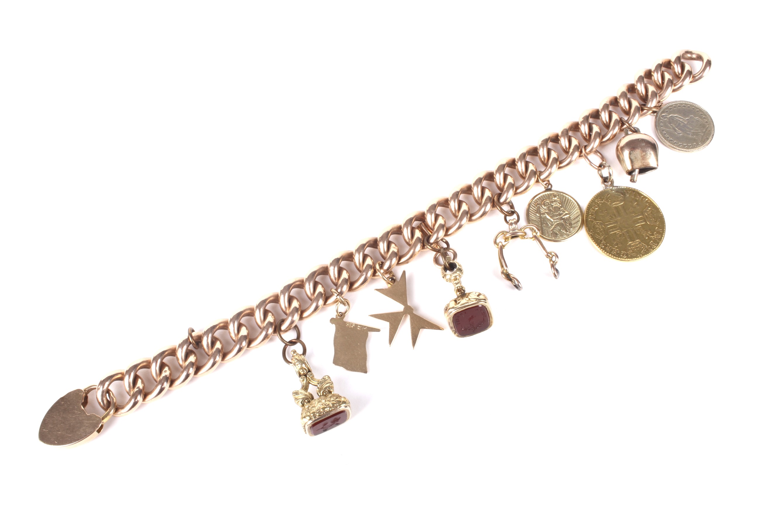 An early 20th century rose gold curb link 'charm' bracelet.