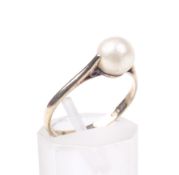 A 9ct gold and cultured-pearl single bead dress ring. The 6.