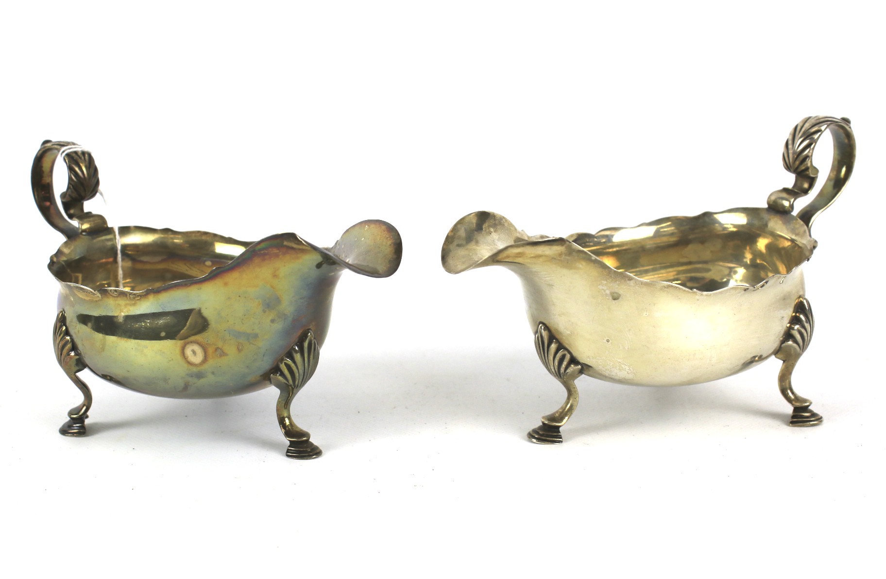 A pair of silver sauce boats with foliate decorated handles. Raised on shell and hoof supports. - Image 2 of 6