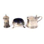 A silver salt, mustard pot and salt shaker (with liner). Various makers and hallmarks.