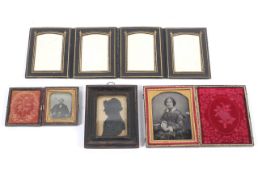 Two Victorian daguerreotypes, a leather photograph holder and a silhouette portrait.
