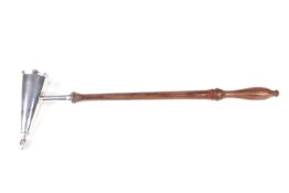 A silver candle snuffer. With turned mahogany handle.