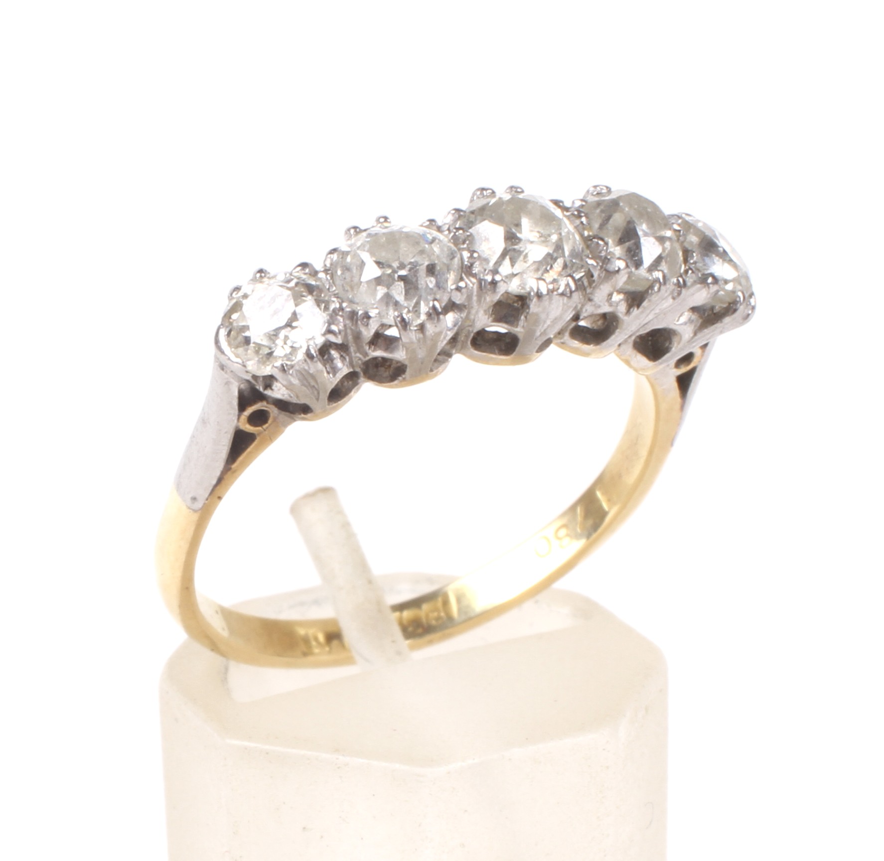 An early 20th century gold and diamond five stone ring.