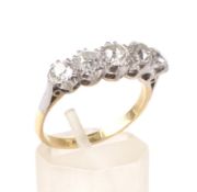 An early 20th century gold and diamond five stone ring.