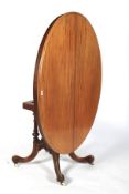 A Victorian walnut loo table.