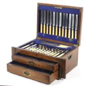 A large oak cased twelve setting canteen of silver plated cutlery.
