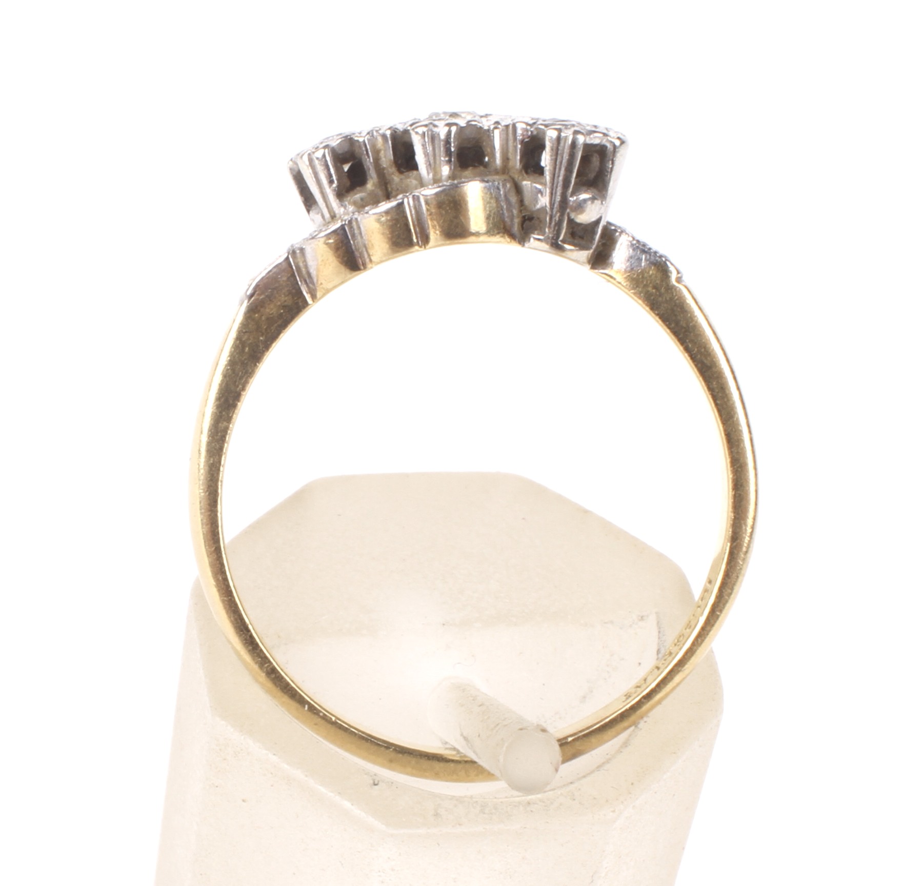 A mid 20th century gold and diamond three stone cross-over ring. - Image 3 of 4