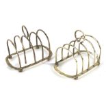 A pair of four branch silver toast racks.