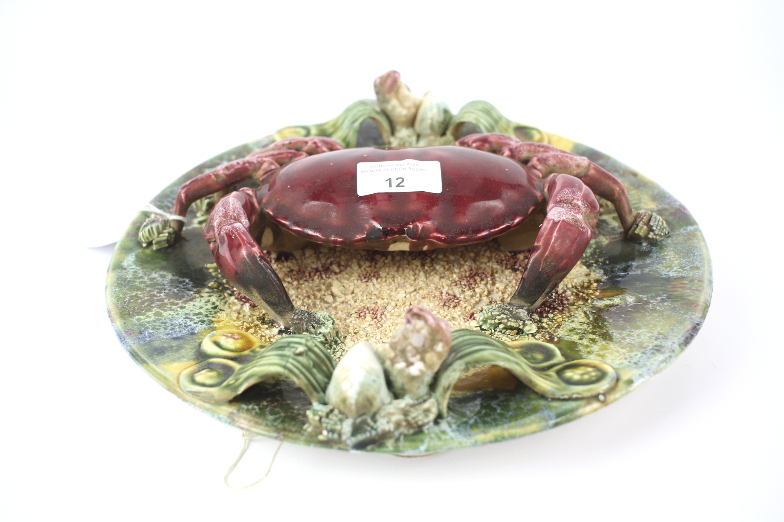 A 20th century majolica palissy style charger in the form of a crab.