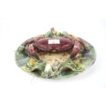 A 20th century majolica palissy style charger in the form of a crab.