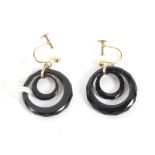 A pair of 9ct gold and onyx earrings. The gold structure supporting two rings of black onyx, L3.