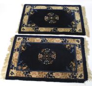 Two small oriental style floor rugs.