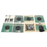 Eight Beatles 7" singles.