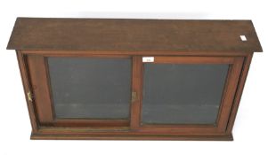 A Victorian mahogany glazed wall cabinet.