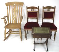 A rocking chair, two red-upholstered chairs and a drop-leaf side table.