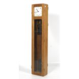 A mid-century beech Synchronome wall hanging electric master clock.