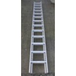 A modern two section aluminum ladder.