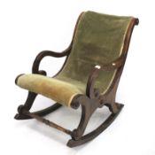 A Victorian mahogany rocking chair.