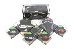 A collection of Formula 1 diecast model vehicles.
