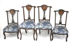 Four 19th century inlaid mahogany chairs.
