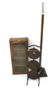 An early 20th century oak wall hanging display cabinet and a three tier cake stand.