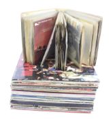 A collection of vintage vinyl records and albums.
