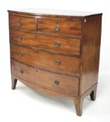 A Victorian mahogany veneer bow fronted chest of drawers.