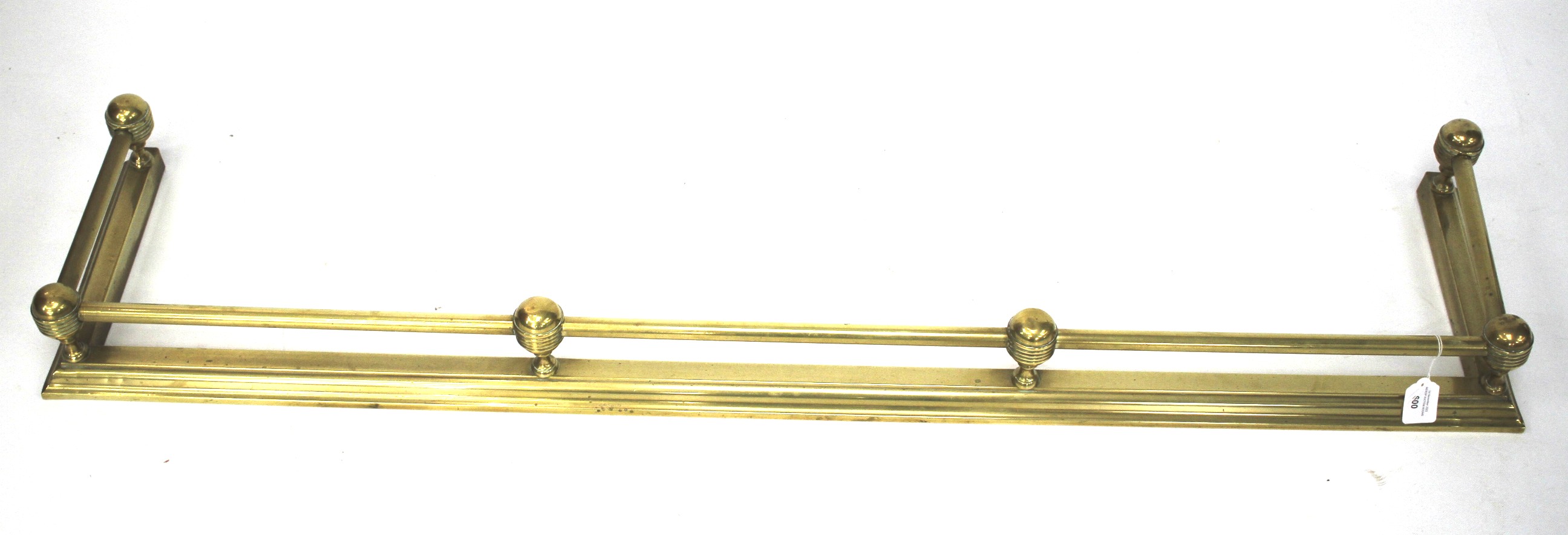 A 20th century brass fender.