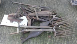 An assortment of vintage farm tools.
