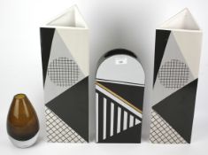 Three Art Deco style ceramic vases and a brown glass vase.