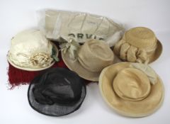 An assortment of vintage ladies hats and other items.